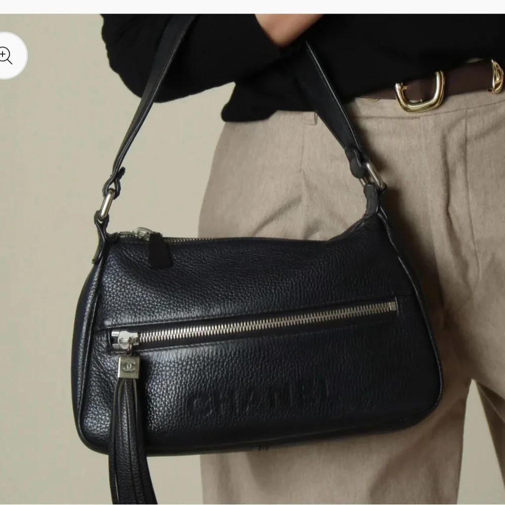 Authentic CHANEL black grained calfskin CC oversized charm baguette hobo bag